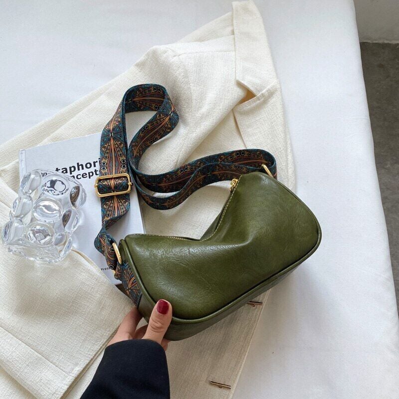 Crossbody bags with embroidered handle