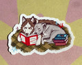 Two dogs reading sticker