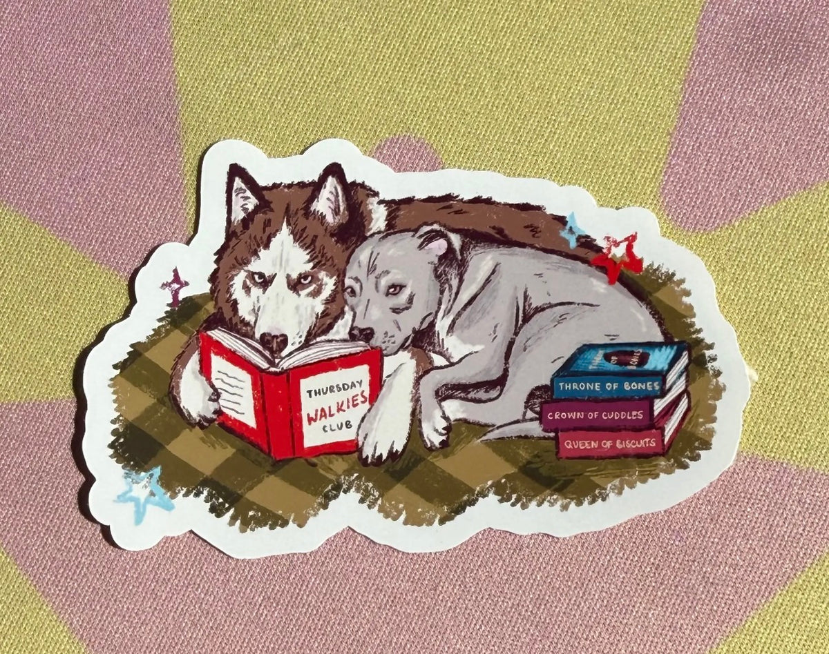 Two dogs reading sticker